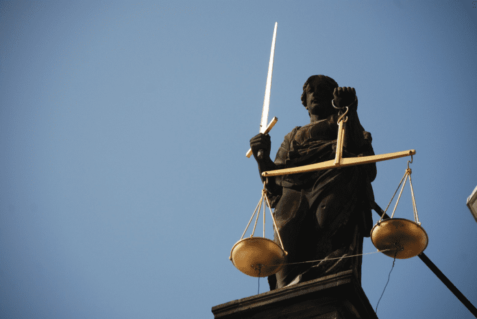 Statue of lady justice with a sword.